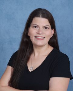 Smiling woman with long dark hair portrait